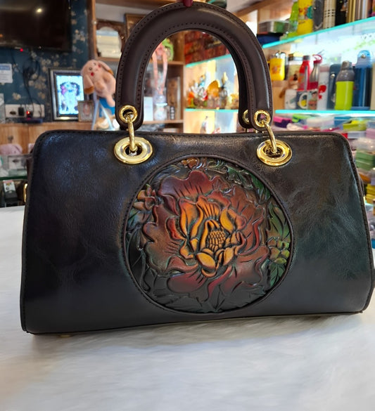 Radiant Charm Handbag with Embossed Floral Design